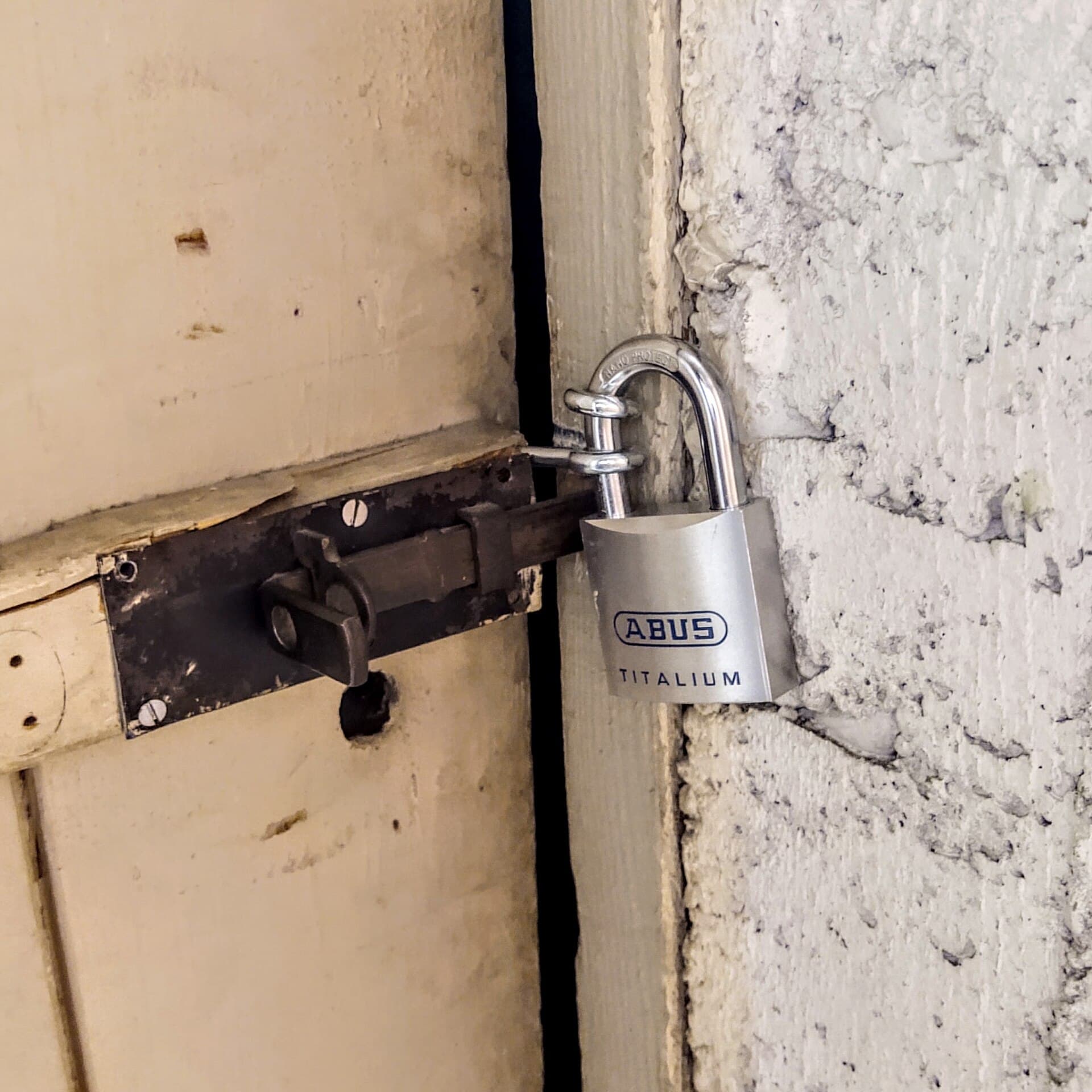 A close-up of a silver padlock
